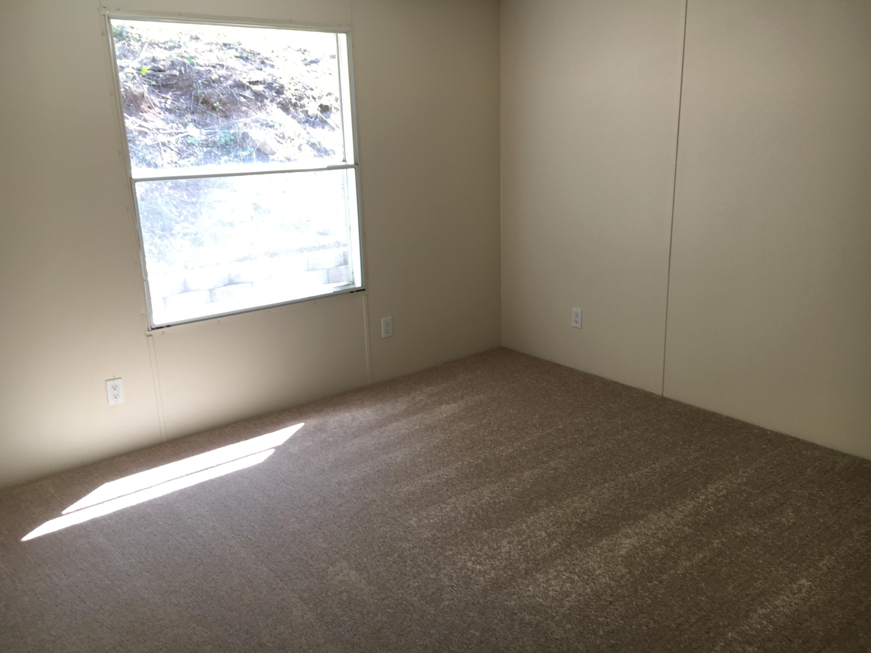 2205 Conner Grove Road Southwest Willis, VA 24380 - Photo 16 of 18 an empty room with a window