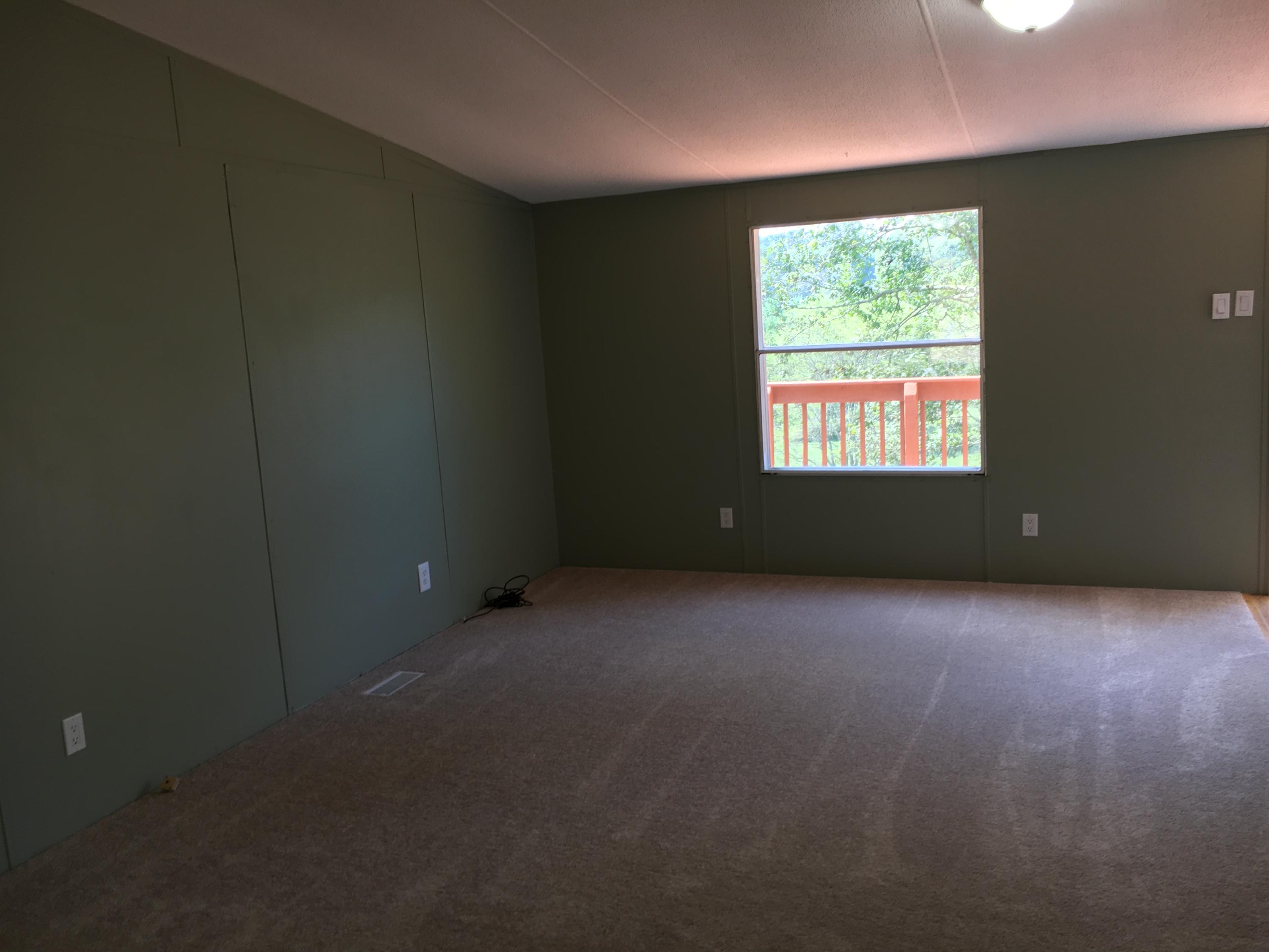 2205 Conner Grove Road Southwest Willis, VA 24380 - Photo 17 of 18 an empty room with a window