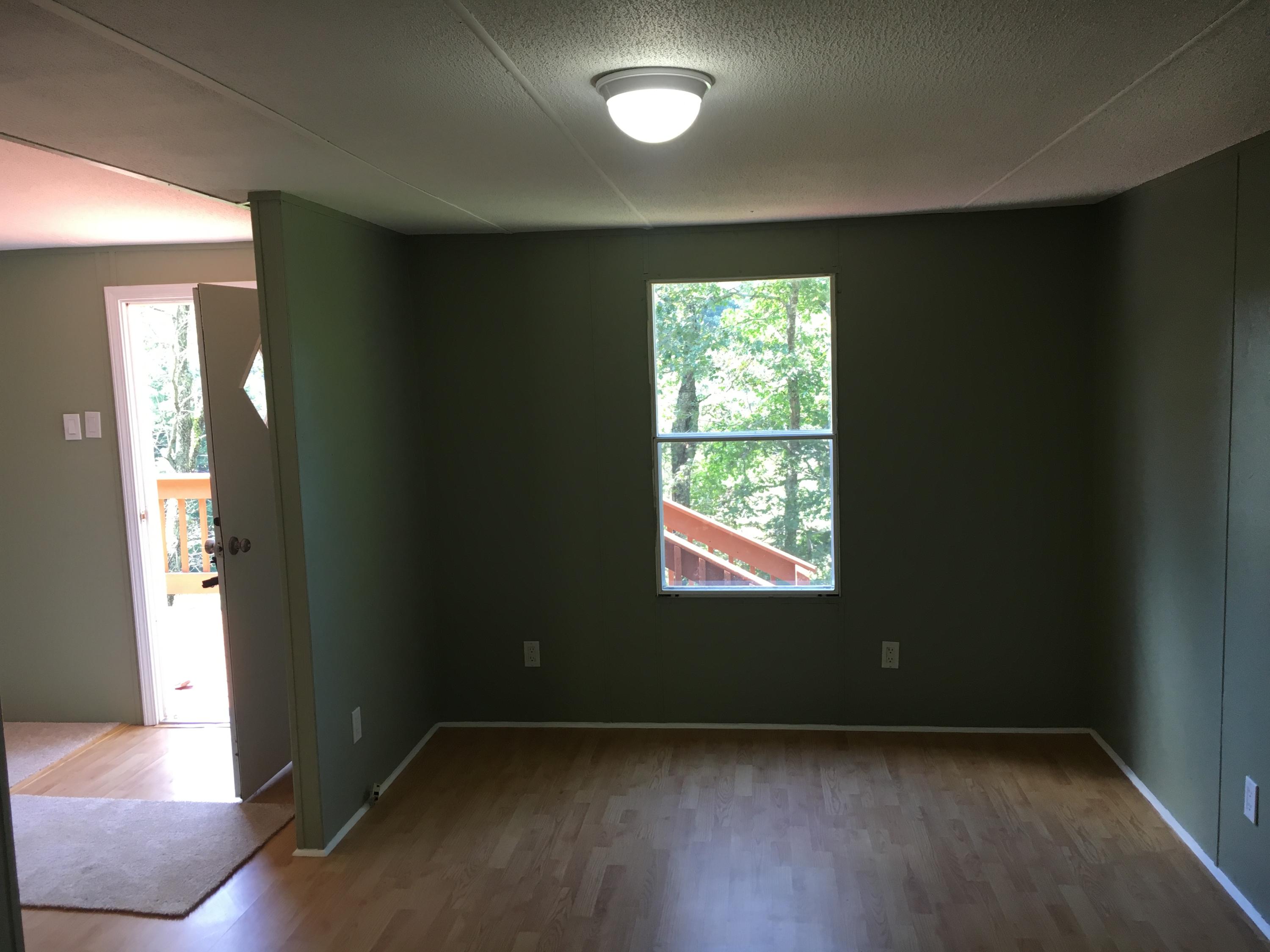 2205 Conner Grove Road Southwest Willis, VA 24380 - Photo 18 of 18 an empty room with wooden floor and windows