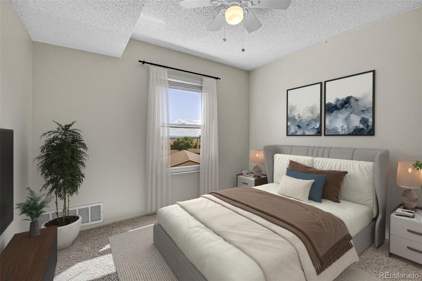 539 Wright Street, Unit 301 Lakewood, CO 80228 - Photo 13 of 32 a bedroom with a bed and a potted plant