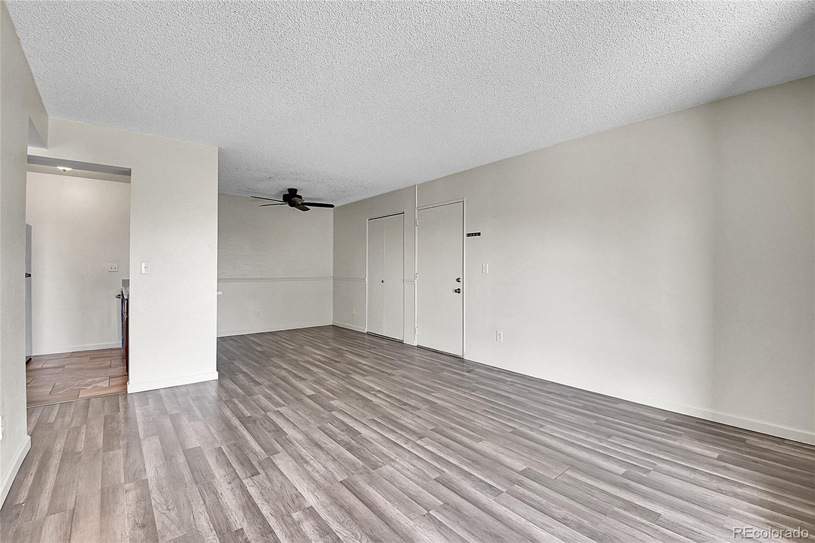 539 Wright Street, Unit 301 Lakewood, CO 80228 - Photo 24 of 32 a view of empty room with wooden floor