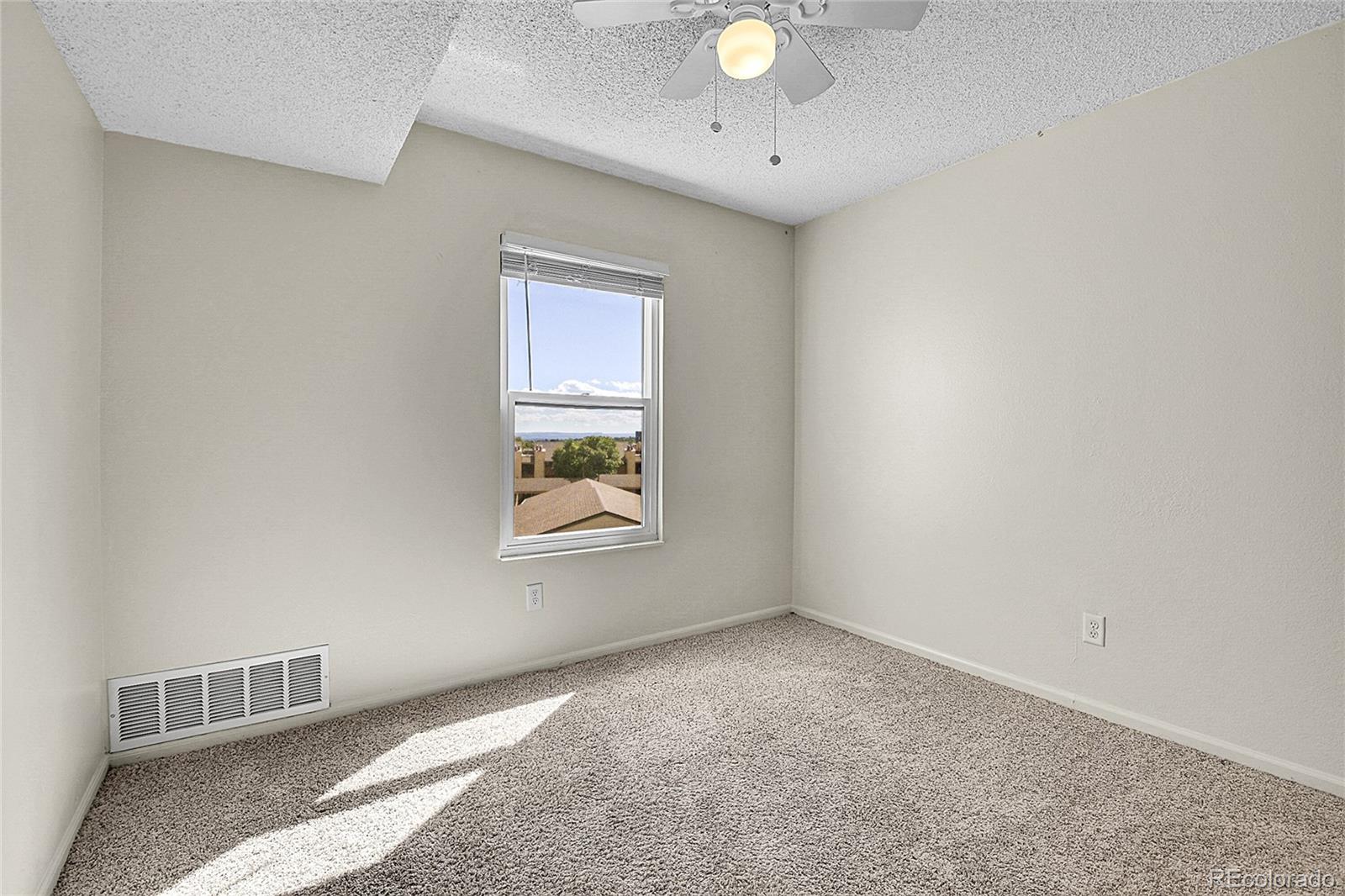 539 Wright Street, Unit 301 Lakewood, CO 80228 - Photo 26 of 32 an empty room with windows