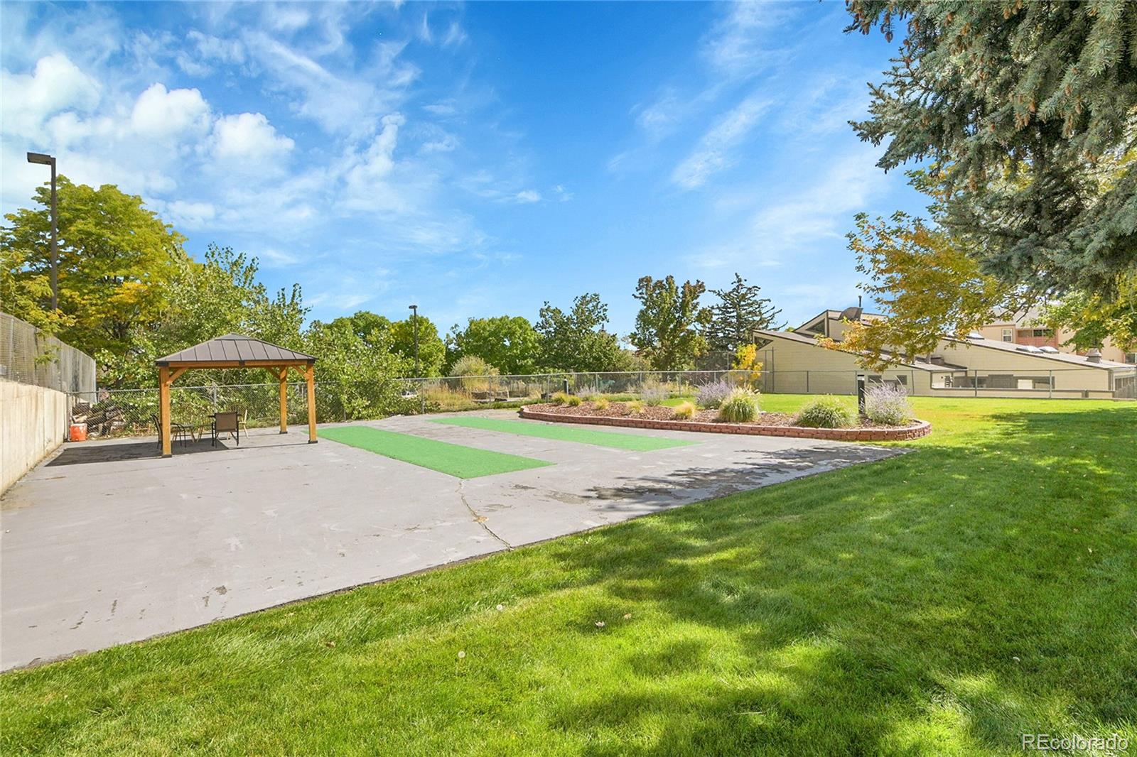 539 Wright Street, Unit 301 Lakewood, CO 80228 - Photo 32 of 32 a view of a park with large trees