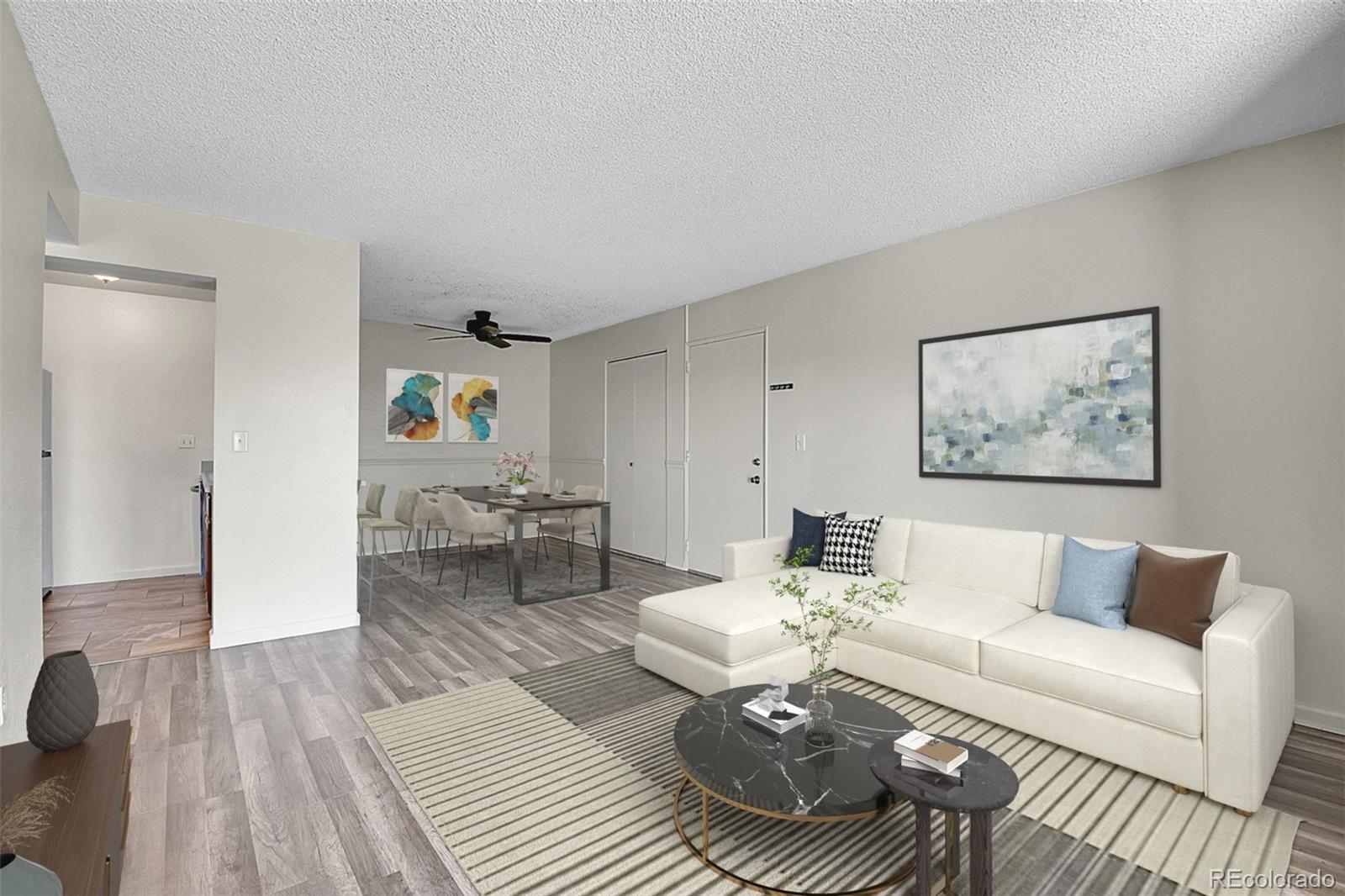 539 Wright Street, Unit 301 Lakewood, CO 80228 - Photo 7 of 32 a living room with furniture and a wooden floor