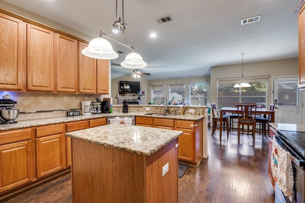 1211 Maple Terrace Drive Mansfield, TX 76063 - Photo 13 of 26 a kitchen with a table and chairs in it