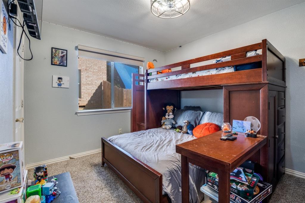 1211 Maple Terrace Drive Mansfield, TX 76063 - Photo 17 of 26 a bed room with furniture and a window