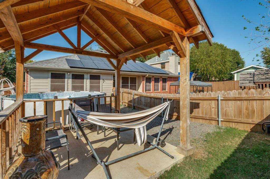 1211 Maple Terrace Drive Mansfield, TX 76063 - Photo 24 of 26 a view of a backyard with table and chairs