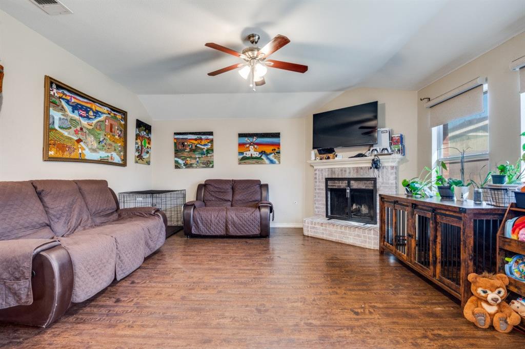 1211 Maple Terrace Drive Mansfield, TX 76063 - Photo 6 of 26 a living room with furniture fireplace and flat screen tv