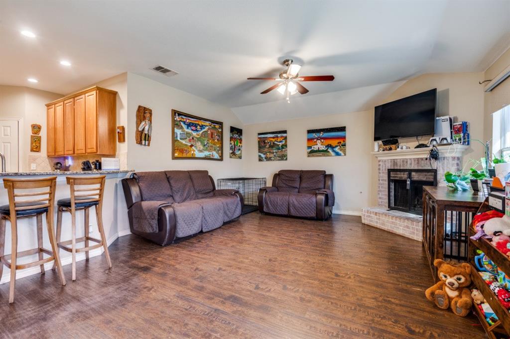 1211 Maple Terrace Drive Mansfield, TX 76063 - Photo 7 of 26 a living room with furniture and a flat screen tv
