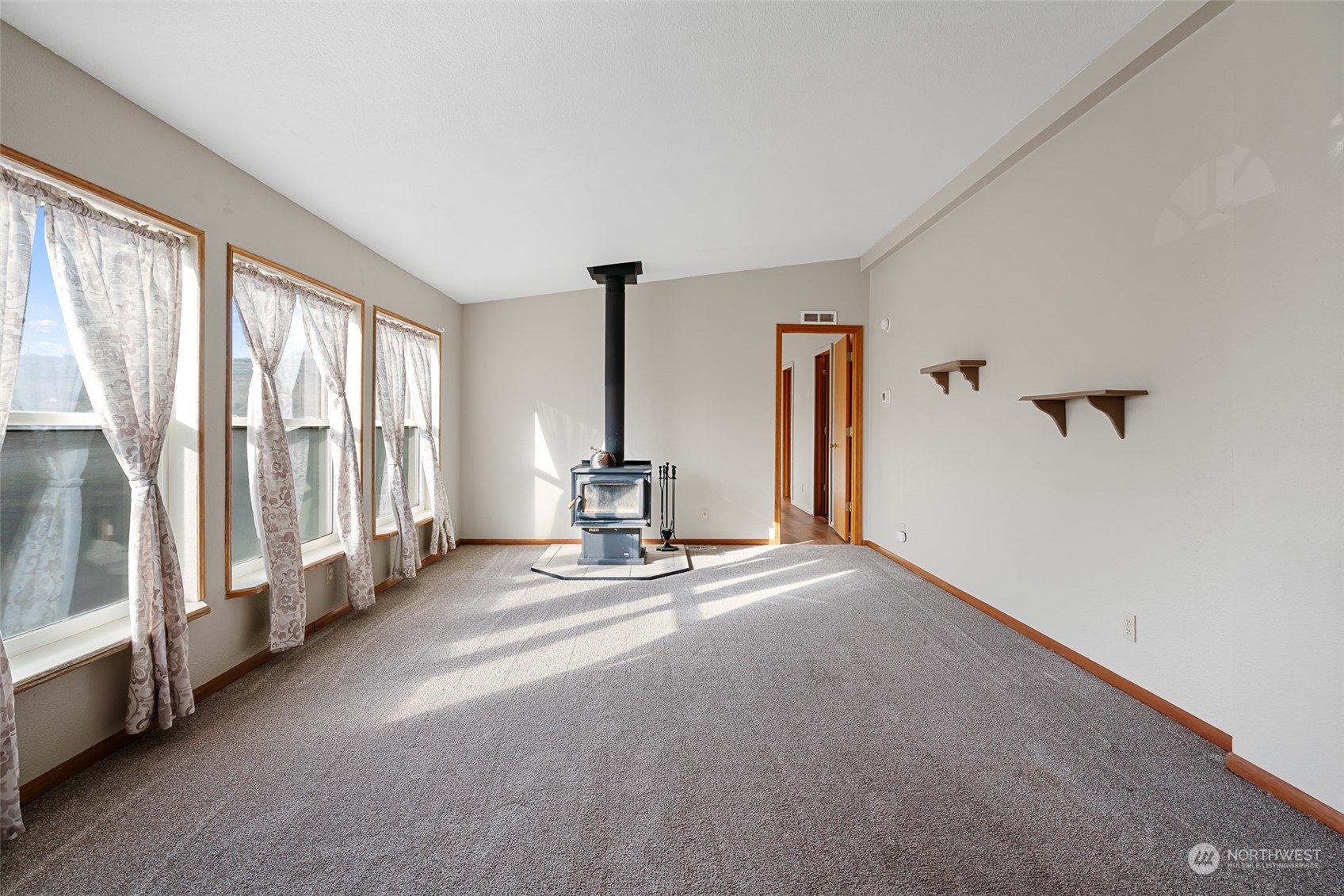 1963 Freimuth Road Selah, WA 98942 - Photo 5 of 33 a view of an empty room with a fireplace and a window
