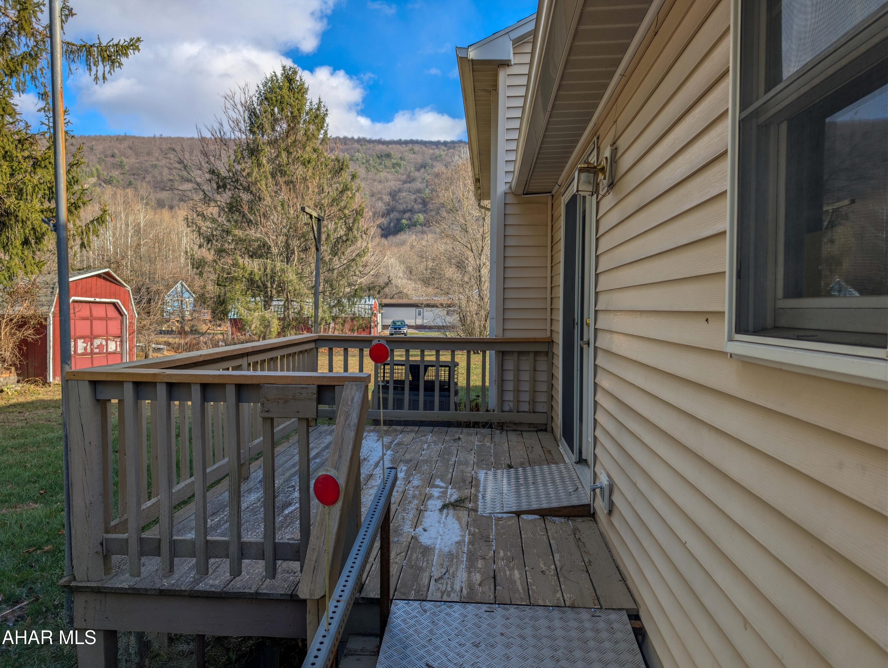 147 Pine Street Hyndman, PA 15545 - Photo 5 of 44 a view of balcony with wooden floor and outdoor seating