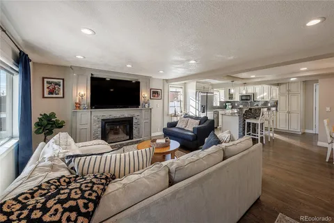 a living room with furniture fireplace and a flat screen tv