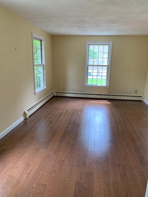 5 Countryside Way Andover, MA 01810 - Photo 15 of 41 an empty room with wooden floor and windows