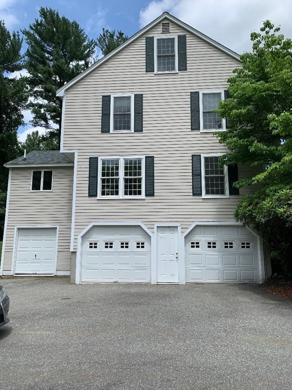 5 Countryside Way Andover, MA 01810 - Photo 27 of 41 a front view of a house with large windows