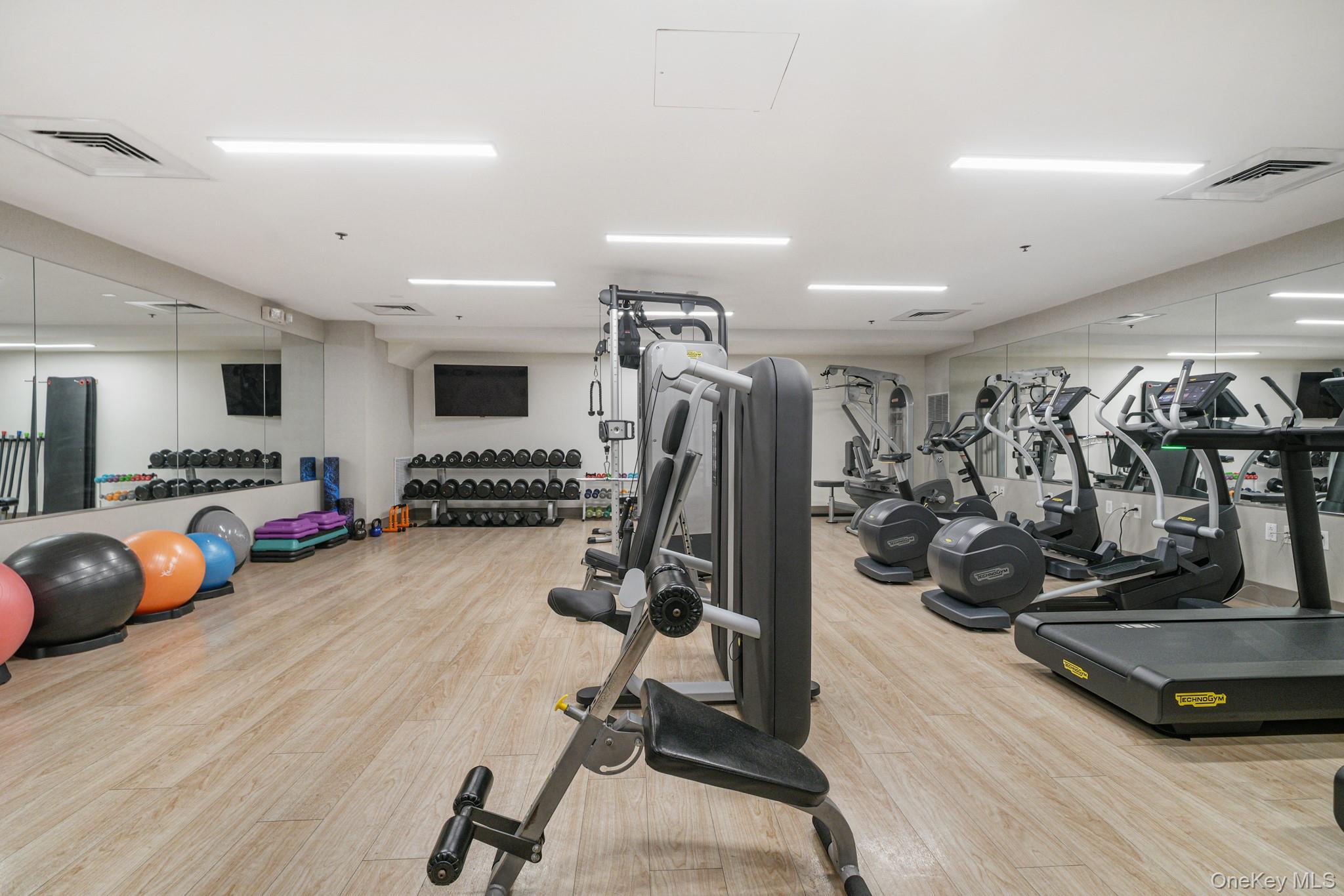 1 Renaissance Square, Unit 15E White Plains, NY 10601 - Photo 21 of 27 a view of a room with gym equipment