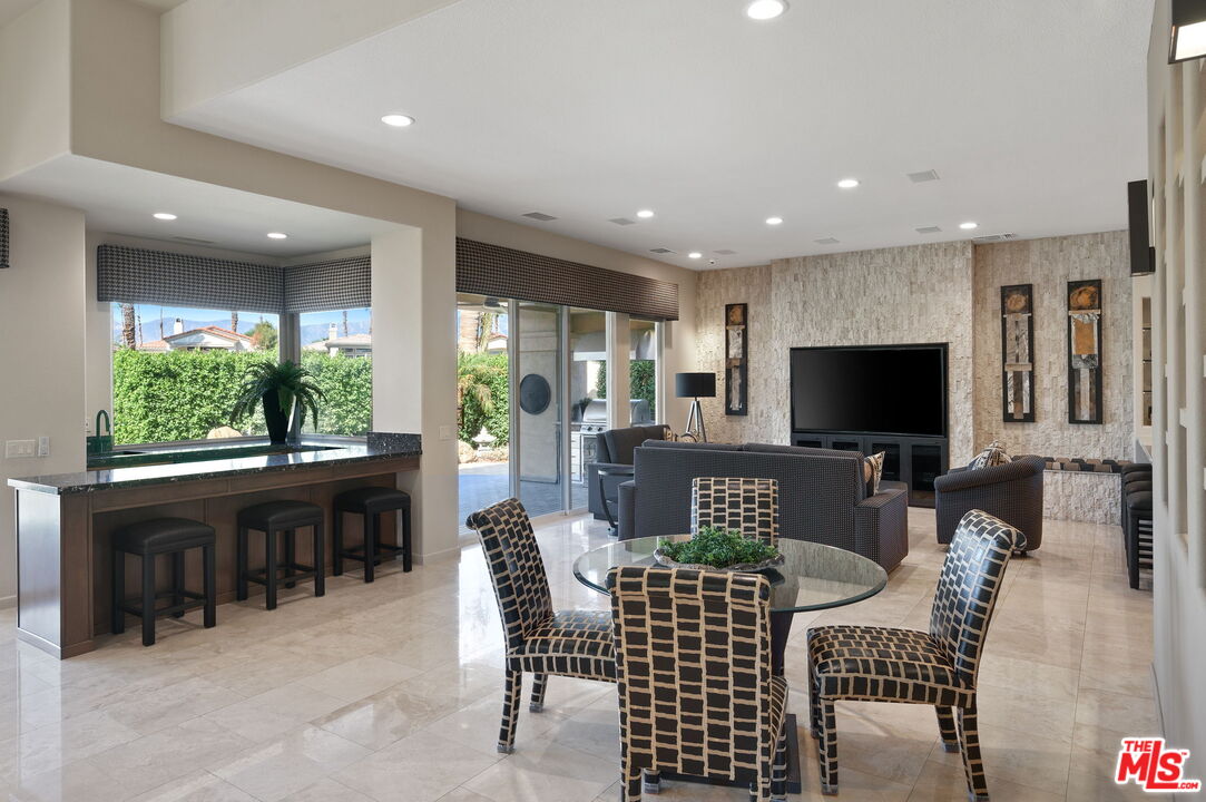 331 Tomahawk Drive Palm Desert, CA 92211 - Photo 11 of 40 a view of a dining room with furniture window and outside view