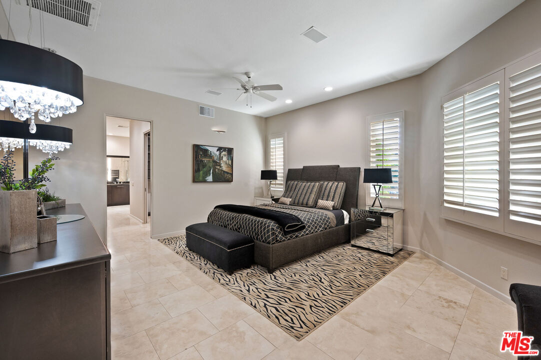 331 Tomahawk Drive Palm Desert, CA 92211 - Photo 17 of 40 a bedroom with a bed window and couch