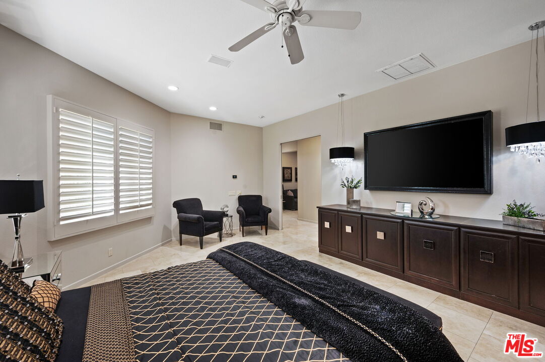 331 Tomahawk Drive Palm Desert, CA 92211 - Photo 18 of 40 a living room with furniture and a flat screen tv