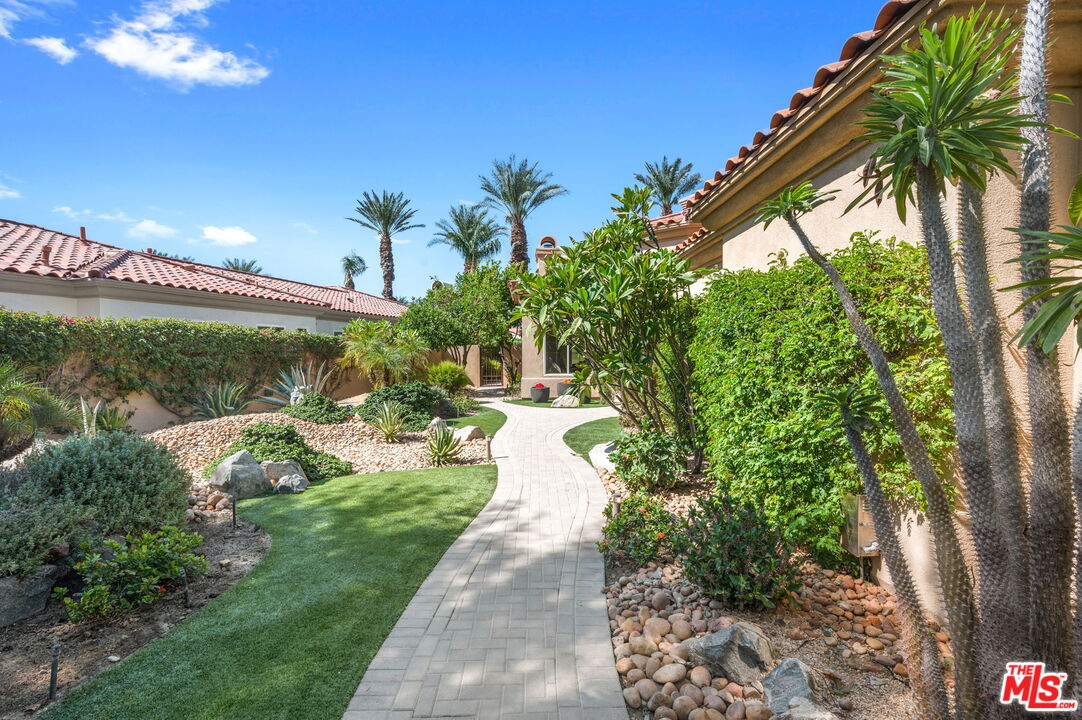 331 Tomahawk Drive Palm Desert, CA 92211 - Photo 2 of 40 a view of a pathway with a yard