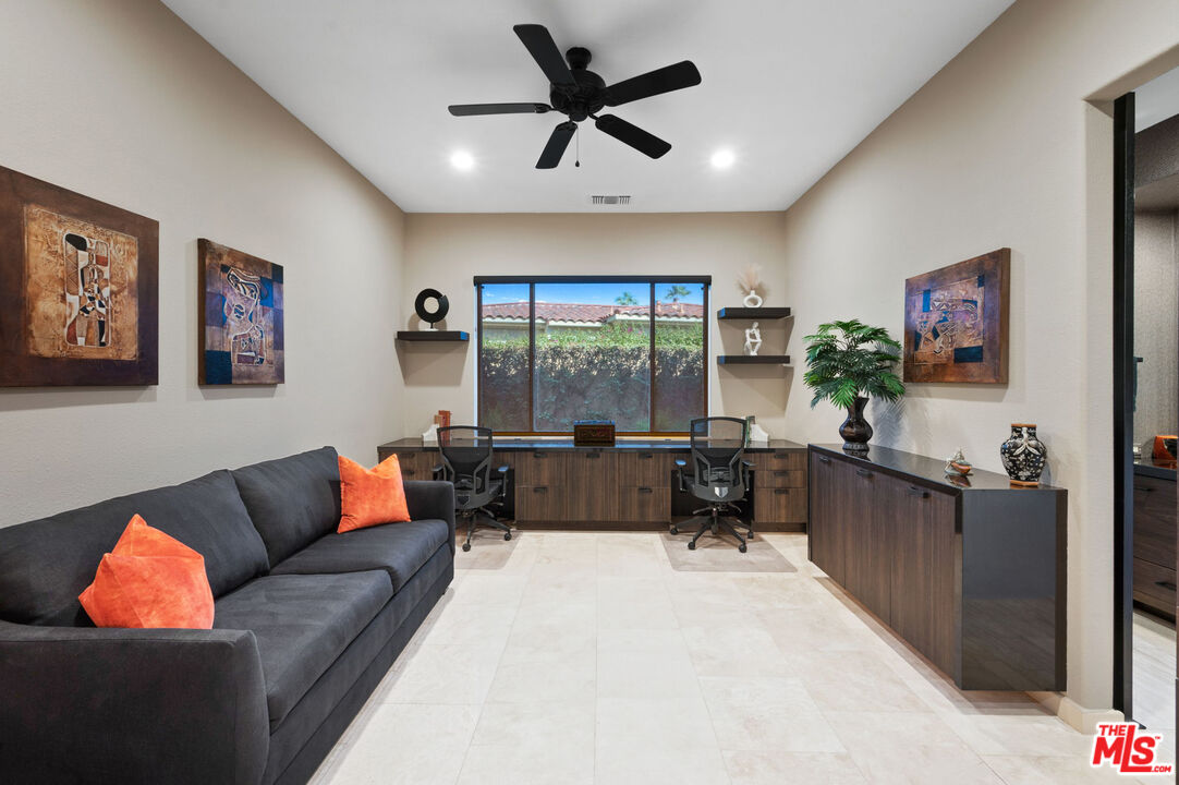 331 Tomahawk Drive Palm Desert, CA 92211 - Photo 24 of 40 a living room with furniture and a large window