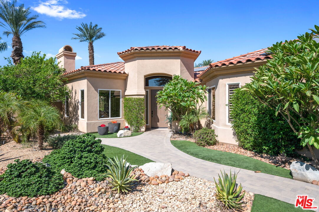 331 Tomahawk Drive Palm Desert, CA 92211 - Photo 3 of 40 a front view of a house with garden