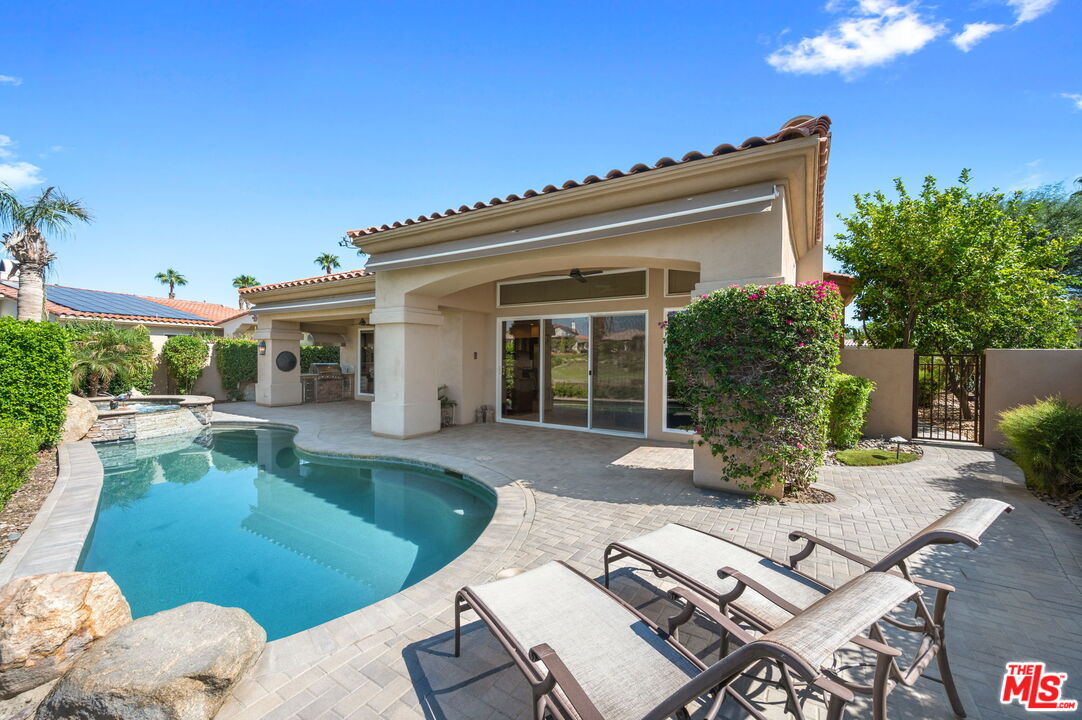 331 Tomahawk Drive Palm Desert, CA 92211 - Photo 35 of 40 a view of a house with backyard sitting area and swimming pool