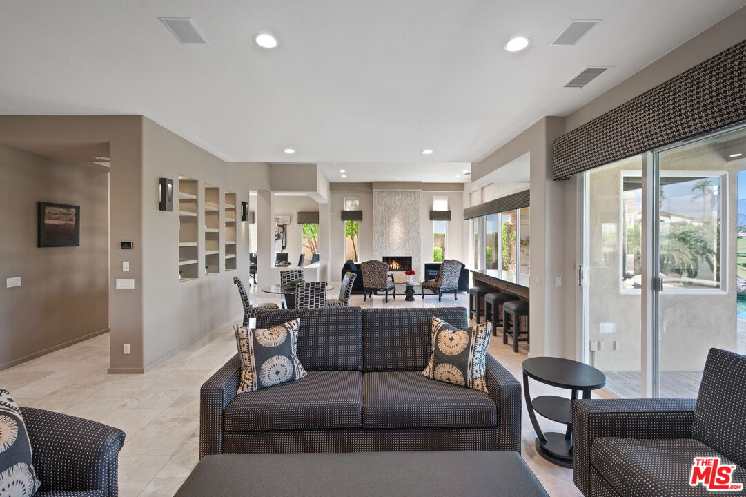 331 Tomahawk Drive Palm Desert, CA 92211 - Photo 9 of 40 a living room with furniture and a large window