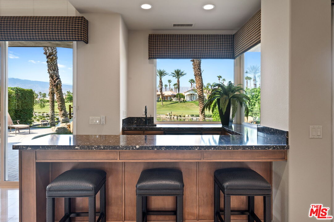 331 Tomahawk Drive Palm Desert, CA 92211 - Photo 10 of 40 a kitchen with a sink and a window