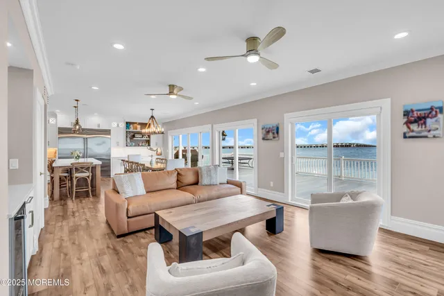 a kitchen with a table chairs refrigerator and cabinets