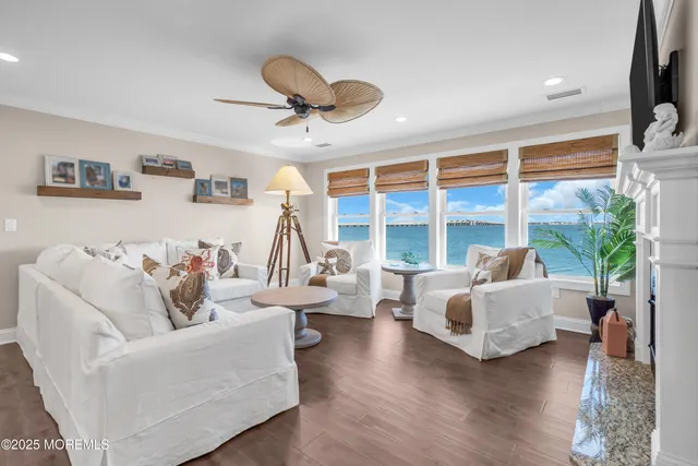 a living room with furniture fireplace and a flat screen tv