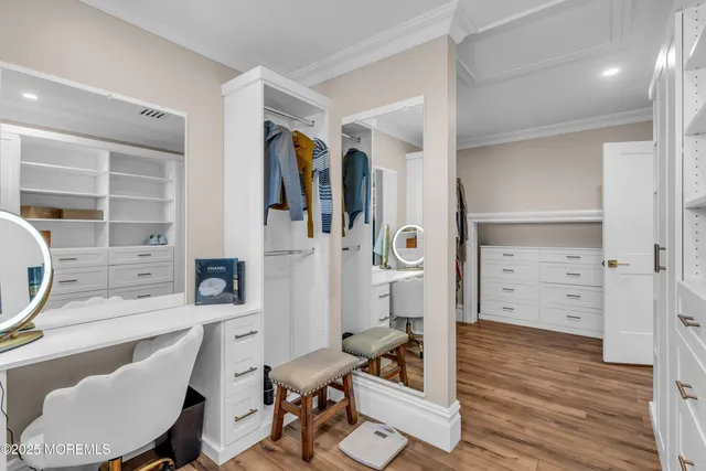 a spacious bedroom with a bed and a window