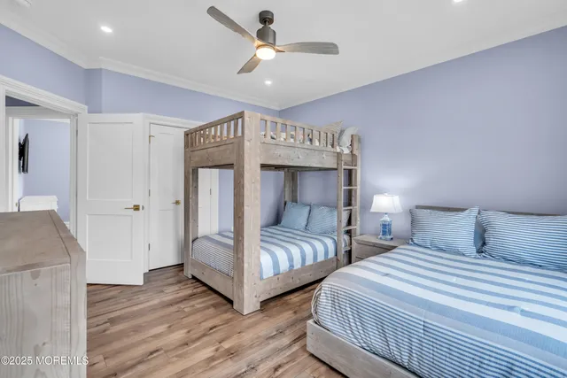 a bathroom with a double vanity sink a mirror and shower