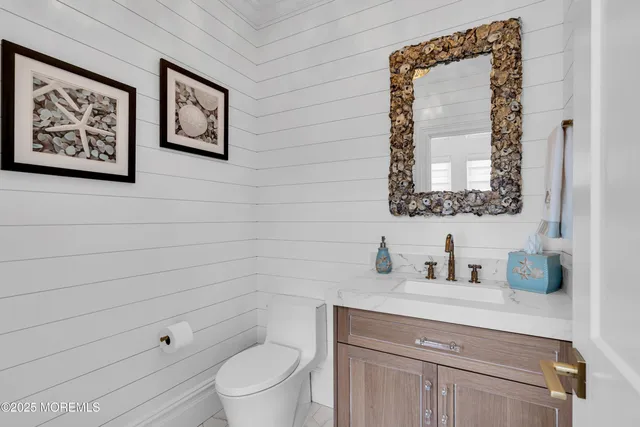 a living room with furniture and a kitchen view