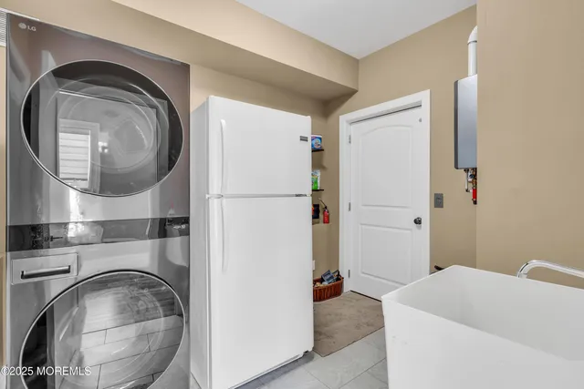a view of a dining area with furniture and a ceiling fan