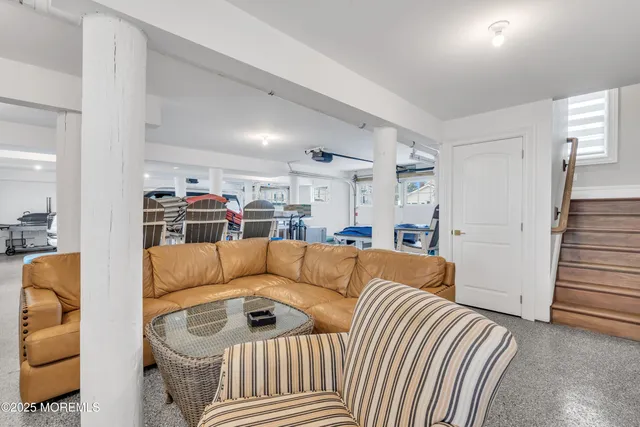 a view of a kitchen with a sink and a large window