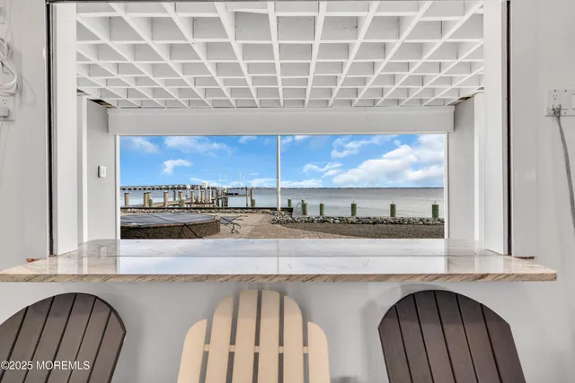 a kitchen with stainless steel appliances granite countertop a sink and a stove