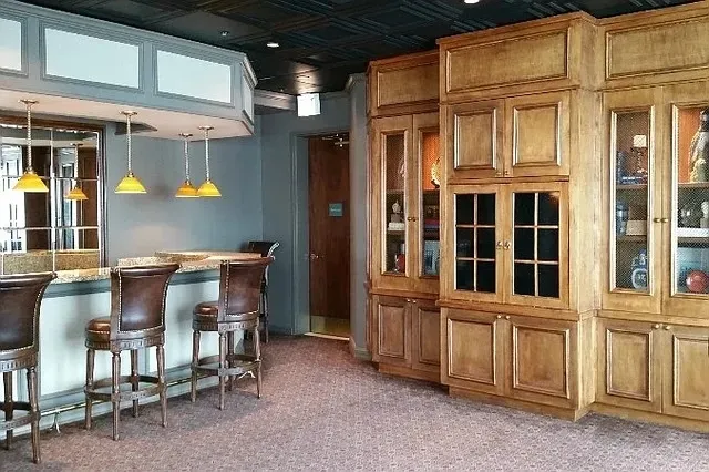 a view of a room with a table and chairs