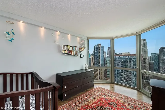 a room with lots of wooden furniture and a book shelf