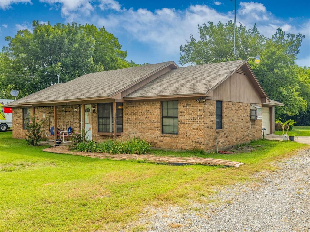 a view of a house with garden and yard