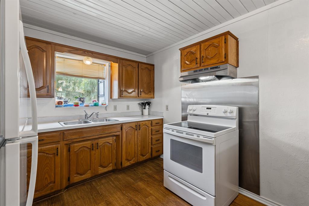 a kitchen with stainless steel appliances granite countertop a stove and a sink
