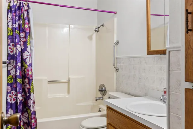 a view of a house with a yard and sitting area