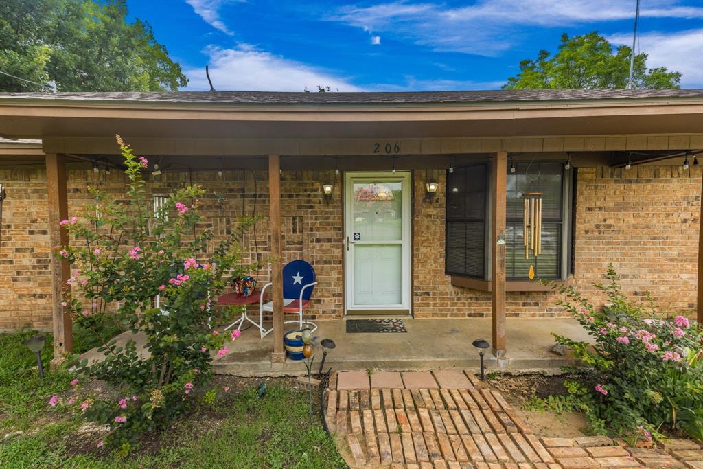 206 North Main Street Bailey, TX 75452 - Photo 28 of 30 a front view of a house with outdoor seating