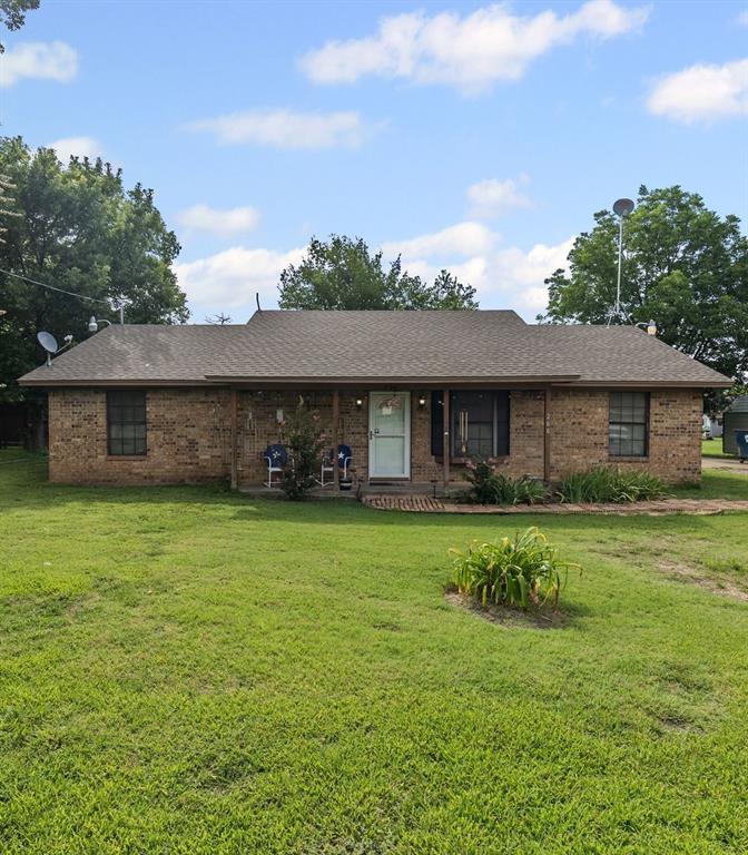 206 North Main Street Bailey, TX 75452 - Photo 4 of 30 a front view of a house with a garden