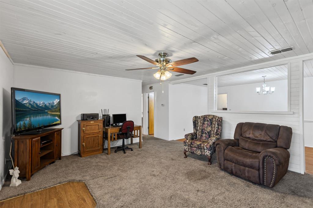 206 North Main Street Bailey, TX 75452 - Photo 5 of 30 a living room with furniture and a flat screen tv