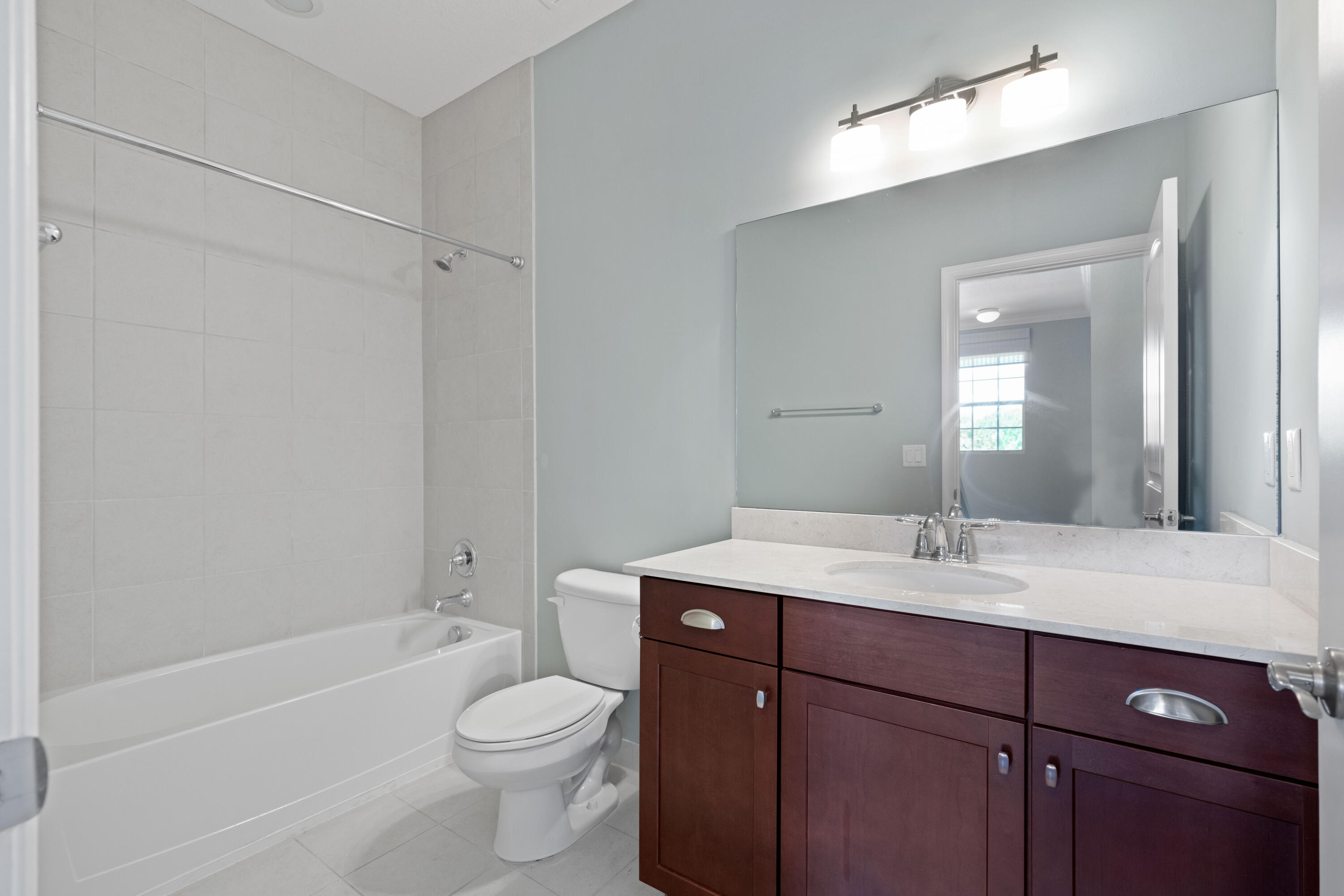 7018 Limestone Cay Road Jupiter, FL 33458 - Photo 12 of 23 a bathroom with a sink a toilet and shower