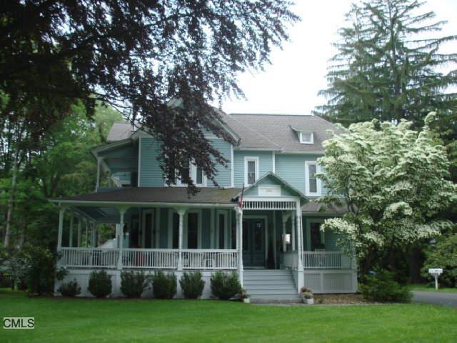 599 Main Street, Unit 2 Ridgefield, CT 06877 - Photo 1 of 1 a view of house with yard