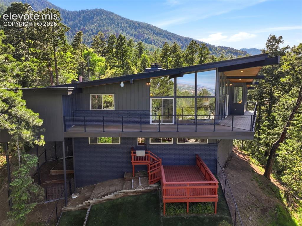 17 Pine Road Colorado Springs, CO 80906 - Photo 46 of 48 Modern architectural exterior featuring expansive window walls