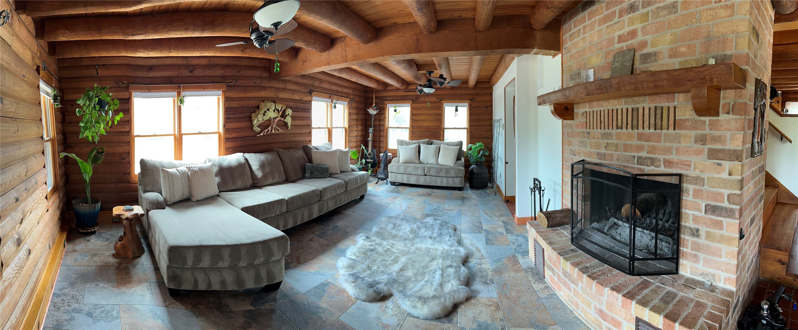 1053 East County Rd F Lexington, TX 78947 - Photo 6 of 38 a living room with furniture and a fireplace
