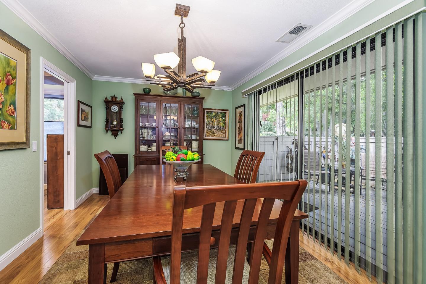 26 Deep Well Lane Los Altos, CA 94022 - Photo 12 of 39 a view of a dining room with furniture a chandelier and wooden floor