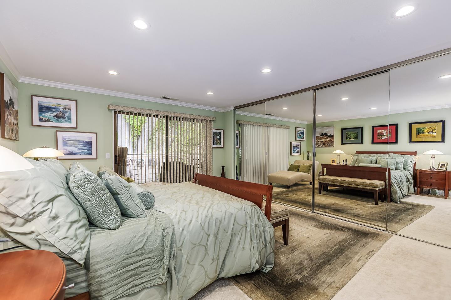 26 Deep Well Lane Los Altos, CA 94022 - Photo 17 of 39 a spacious bedroom with a bed and glass windows